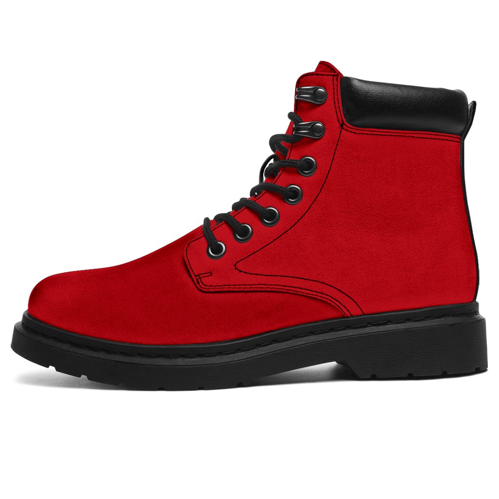 This is a microsuede pair of boots for men and women. It is a red colour all over. The boot has a black sole black trim, black laces, and sits above the ankle. It is set on a white background.