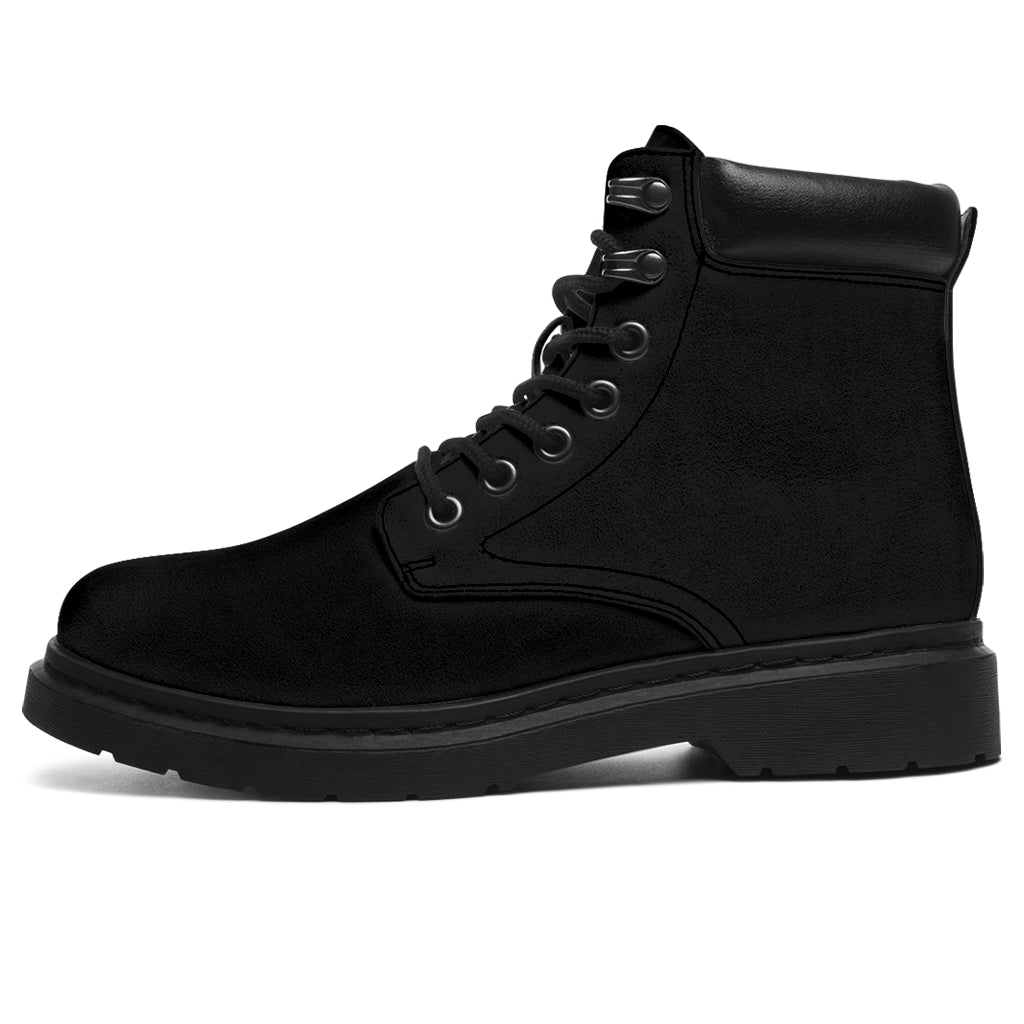 This is a microsuede pair of boots for men and women. It is a black colour all over. The boot has a black sole black trim, black laces, and sits above the ankle. It is set on a white background.