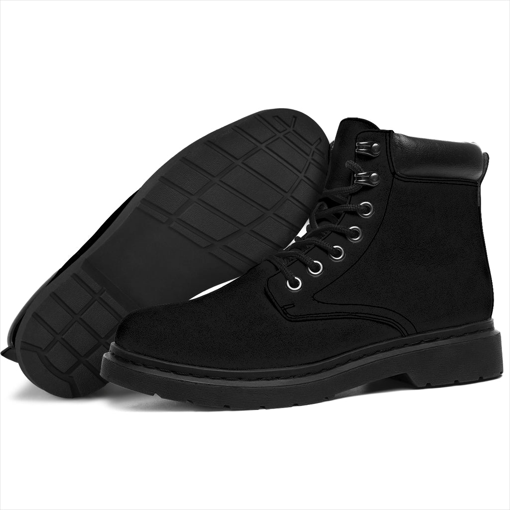 This is a microsuede pair of boots for men and women. It is a black colour all over. The boot has a black sole black trim, black laces, and sits above the ankle. It is set on a white background.