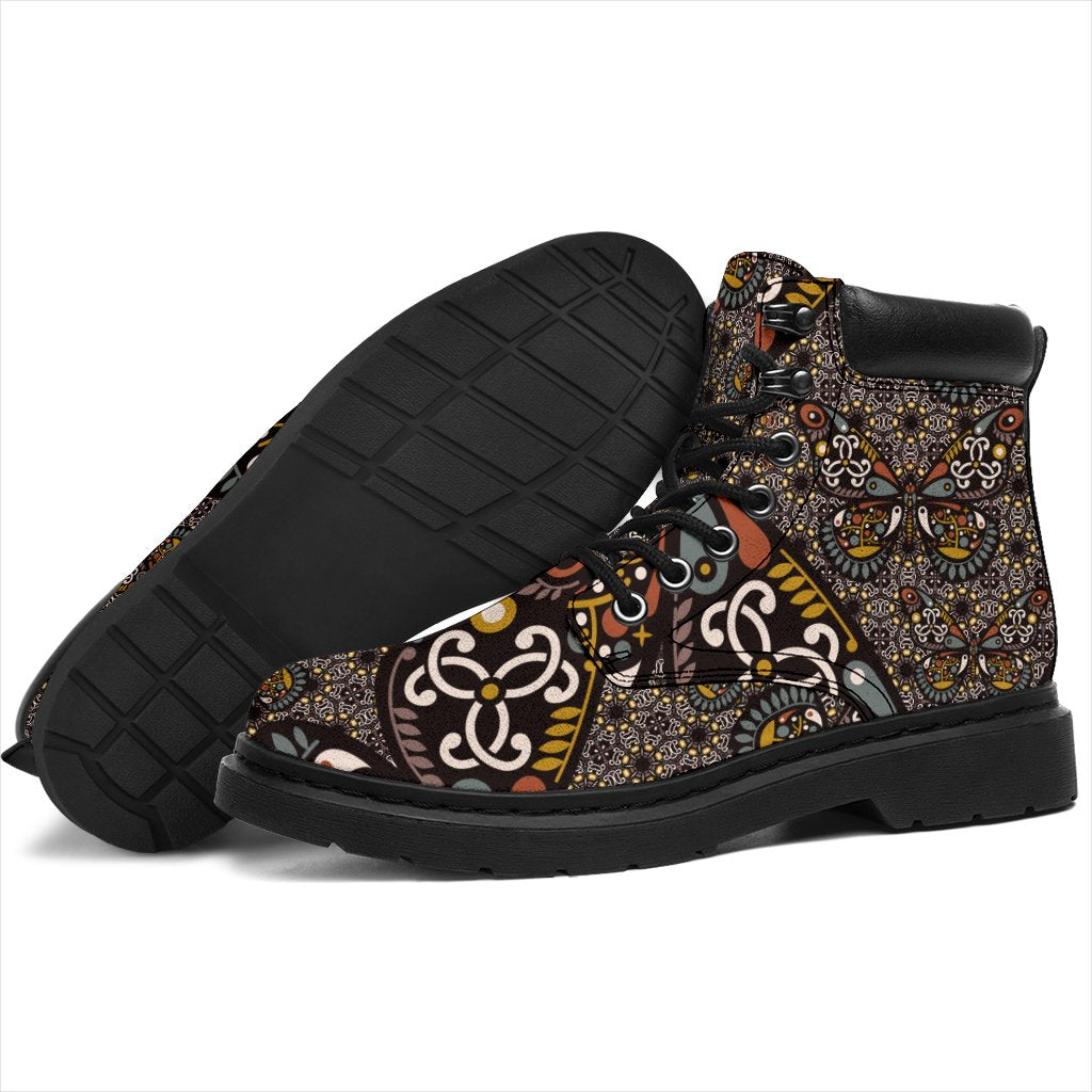 This is a microsuede pair of boots for men and women.  It has a butterfly, yin yan print, with mustard, white, tan, grey and black colours through it.  The boot has a black sole black trim, black laces, and sits above the ankle.