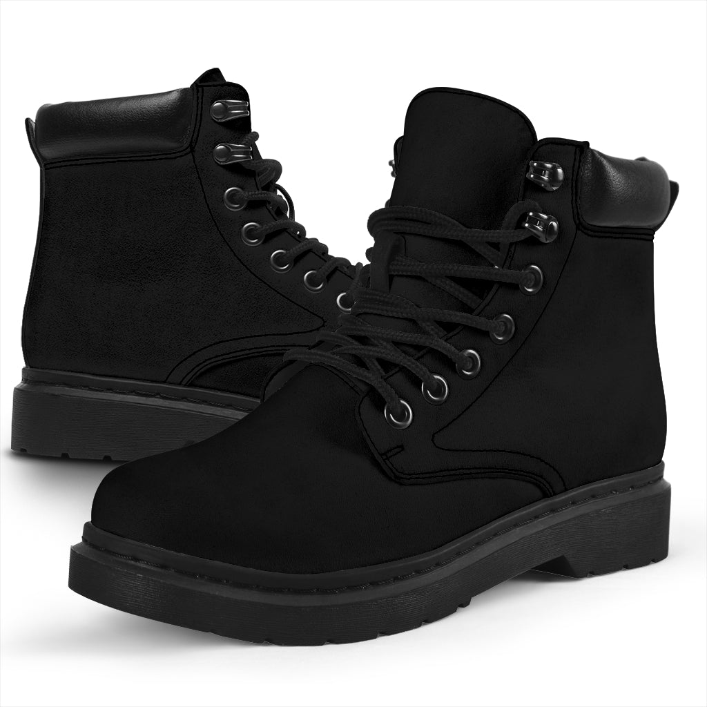 This is a microsuede pair of boots for men and women. It is a black colour all over. The boot has a black sole black trim, black laces, and sits above the ankle. It is set on a white background.