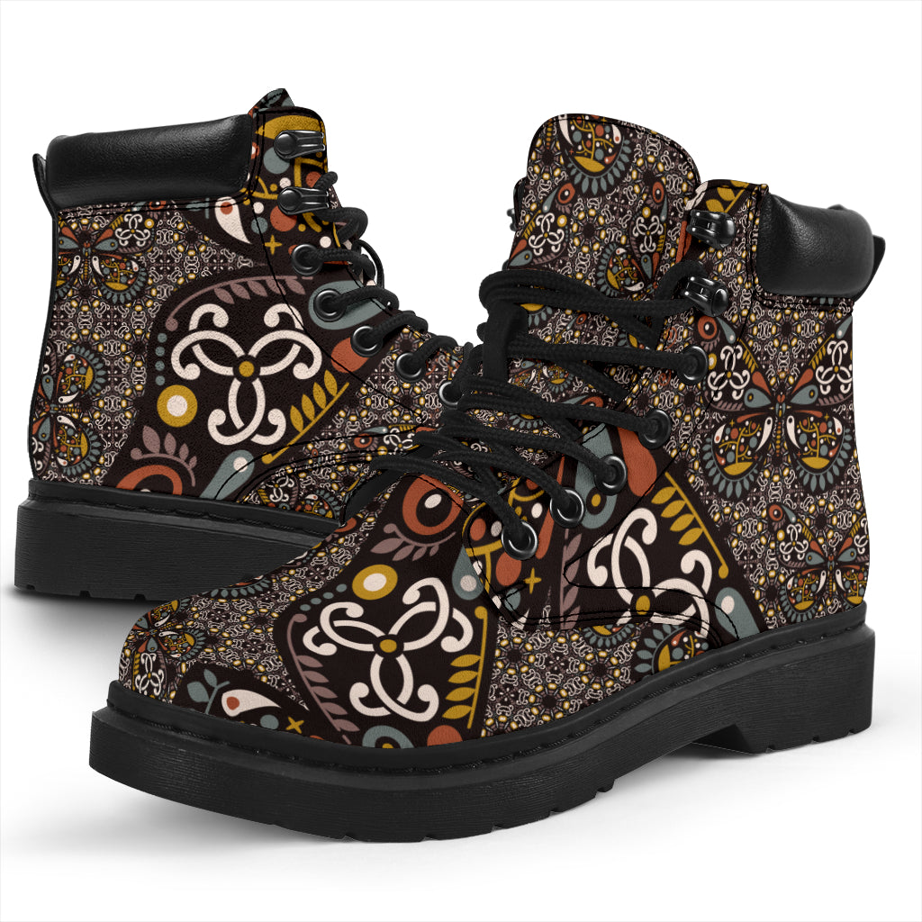 This is a microsuede pair of boots for men and women.  It has a butterfly, yin yan print, with mustard, white, tan, grey and black colours through it.  The boot has a black sole black trim, black laces, and sits above the ankle.